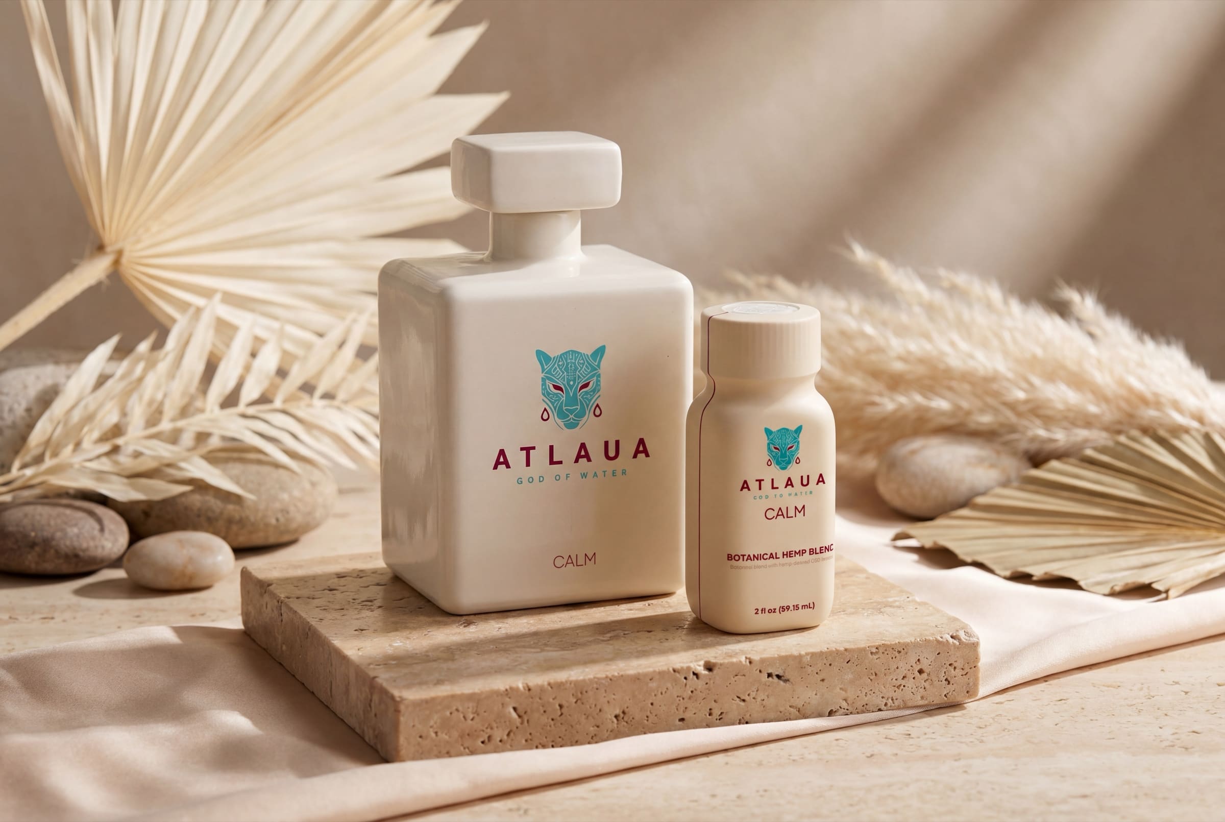 ATLAUA CALM ceramic bottle and 2 oz shot on travertine with dried palm leaves