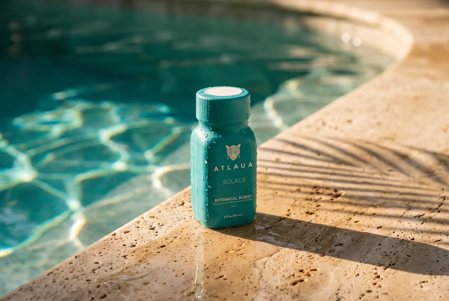 ATLAUA SOLACE on the sunlit stone edge of a pool